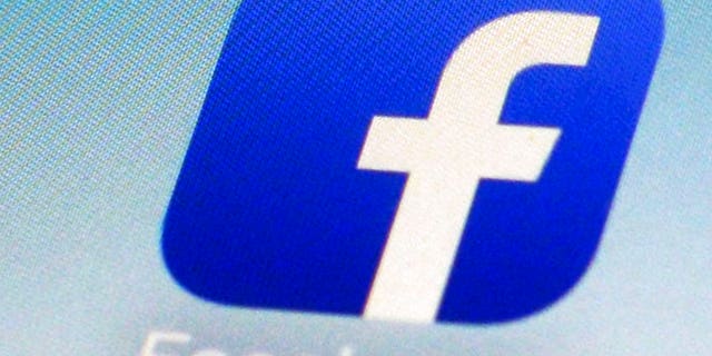 FILE - This Feb. 19, 2014, file photo, shows a Facebook app icon on a smartphone in New York. (AP Photo/Patrick Sison, File)