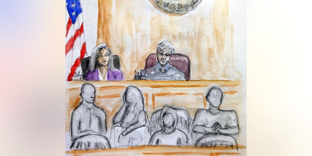 In this courtroom sketch Judge Richard Moore, top right, presides over the trial of James Alex Fields Jr. during the second day of jury selection in Charlottesville General District Court in Charlottesville, Va., Tuesday, Nov. 27, 2018. Fields is accused of killing a woman during a white nationalist rally in Virginia last year. (Izabel Zermani via AP)