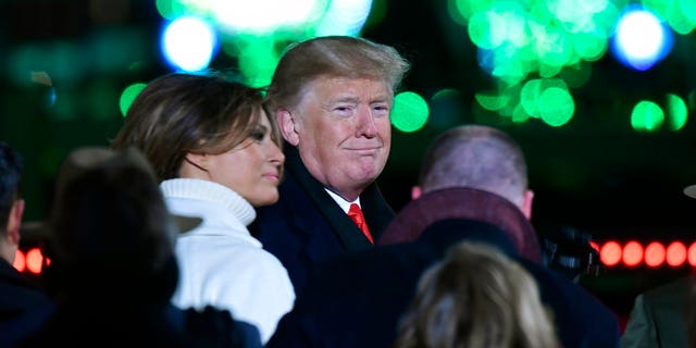 President Donald Trump and first lady Melania Trump attend the annual National Christmas Tree Lighting ceremony on the Ellipse in Washington, Wednesday, Nov. 28, 2018. (AP Photo/Susan Walsh)