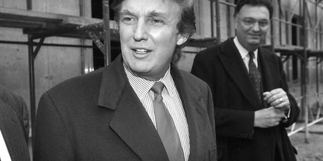 In this Nov. 5, 1996 file photo, American real estate mogul Donald Trump, left, checks out sites in Moscow, Russia, for luxury residential towers. Trump's decades-long dream of building a luxury tower in the heart of Moscow flared and fizzled several times over the years, most recently when his presidential campaign was gaining momentum.