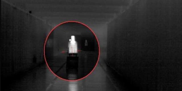 A shooter fires on a target at a Fort Belvoir, Va., firing range, July 27, 2017, using an Enhanced Night Vision Goggle III on his helmet, and a Family of Weapons Sights-Individual on an M4 rifle. Here, the combined video feed from both the sight and the goggle puts the reticle from the weapon onto the video feed the shooter is seeing in his goggle. (Photo Credit: PEO Soldier)