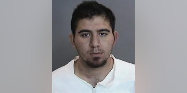 Amer Alhasan, 28, was arrested Wednesday just hours before allegedly fleeing the country, police said.