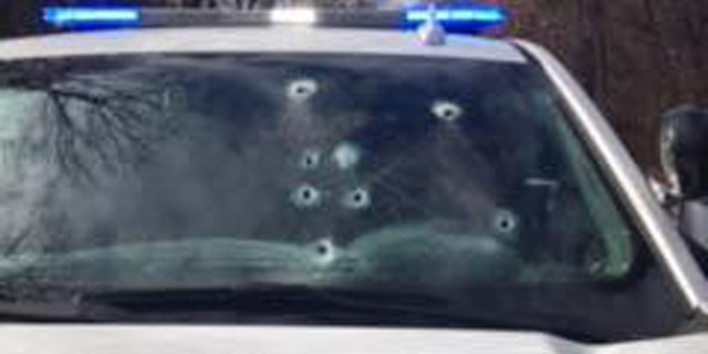 Bullet holes can be seen in Corporal Brett Thompson's vehicle after the shooting