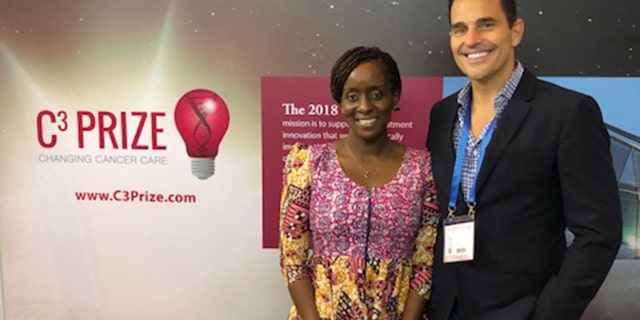 Bill Rancic with 2018 C3 Prize pitch winner, Ebele Mbanugo.