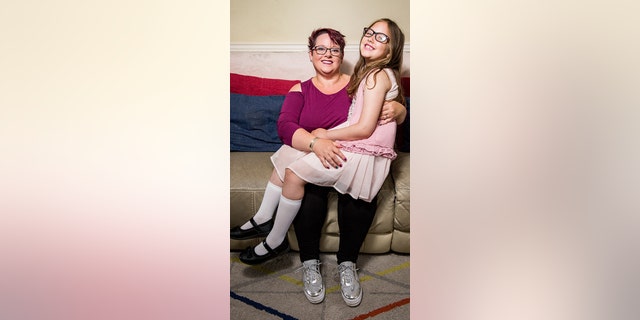 Sharon Spink, 50, pictured with her 9-year-old daughter Charlotte, who she continued to breastfeed until recently.