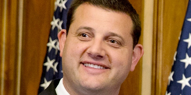 Rep. David Valadao, R-Calif., poses during a ceremonial re-enactment of his swearing-in ceremony
