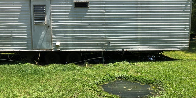 Raw sewage pit in yard of home, Lowndes County, AL.
