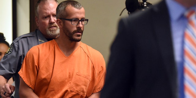 In this Aug. 16 file photo, Christopher Watts is escorted into the courtroom before his bond hearing at the Weld County Courthouse in Greeley, Colorado.
