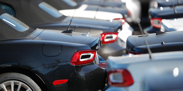 FILE- In this Oct. 21, 2018, file photo a long line of unsold 2018 124 convertibles is shown at a Fiat dealership in Highlands Ranch, Colo. On Wednesday, Nov. 14, the Labor Department reports on U.S. consumer prices for October. (AP Photo/David Zalubowski)
