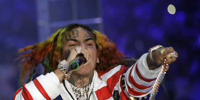 Rapper Tekashi 6ix9ine performs during the Philipp Plein women's 2019 spring-summer collection in Milan, Italy.