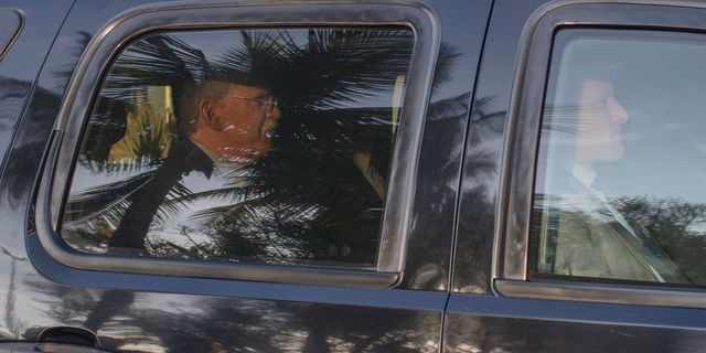 U.S. National Security Adviser John Bolton, in the car on left, arrives for a meeting with Brazil's President-elect Jair Bolsonaro in his residence in Rio de Janeiro, Brazil, Thursday, Nov. 29, 2018. Bolton will travel to Buenos Aires for the two-day Group of 20 summit. (AP Photo/Leo Correa)