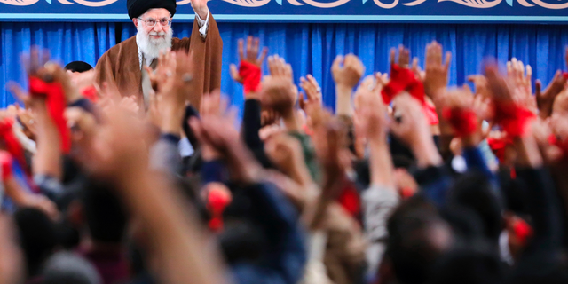 In this picture released by an official website of the office of the Iranian supreme leader, Supreme Leader Ayatollah Ali Khamenei waves to the crowd during a meeting in Tehran, Iran, Saturday, Nov. 3, 2018. Khamenei says on the eve of the anniversary of the 1979 takeover of the U.S. Embassy in Tehran that the Islamic Republic is the "victorious party" after nearly 40 years of confrontation by the U.S. (Office of the Iranian Supreme Leader via AP)