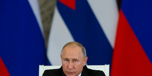 Russian President Vladimir Putin speaks to the media after his talks with Cuban President Miguel Diaz-Canel in the Kremlin in Moscow, Russia, Friday, Nov. 2, 2018. Diaz-Canel is in Moscow for three days of talks aimed to expanding cooperation between the two nations. (AP Photo/Alexander Zemlianichenko)