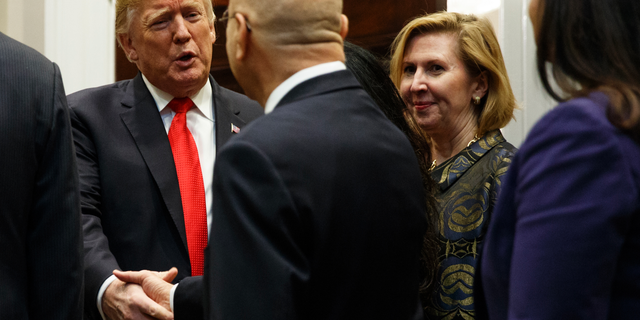 Deputy National Security Adviser Mira Ricardel, right, watches as President Donald Trump arrives for a Diwali ceremonial lighting of the Diya in the Roosevelt Room of the White House, Tuesday, Nov. 13, 2018, in Washington. In an extraordinary move, first lady Melania Trump is publicly calling for the dismissal of Ricardel. After reports circulated that the president had decided to remove Ricardel, the first lady’s spokeswoman issued a statement saying: “It is the position of the Office of the First Lady that she no longer deserves the honor of serving in this White House.” Ricardel is national security adviser John Bolton’s deputy. (AP Photo/Evan Vucci)