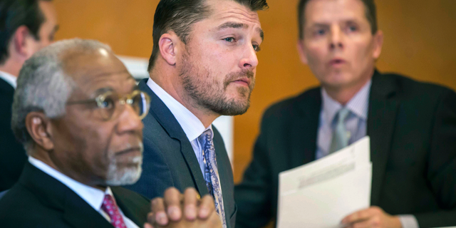 FILE - In this Nov. 27, 2017, file photo, Chris Soules, center, listens during a hearing in court in Independence, Iowa.
