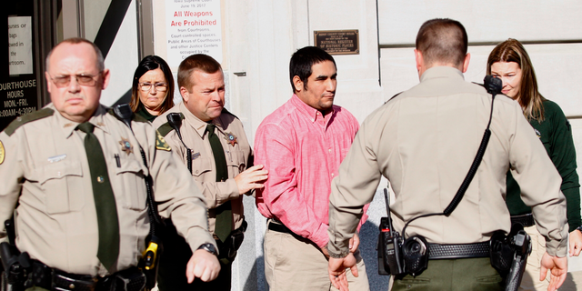 Zachary Koehn is lead out of the courthouse after he was convicted of first-degree murder on Tuesday, Nov. 6, 2018, in Mount Pleasant, Iowa. Koehn was convicted of first-degree murder in the death of his infant son who was found in a maggot-infested baby swing last year.(Jeff Reinitz/The Courier via AP)