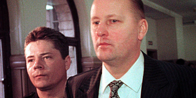 FILE - In a Thursday, April 15, 1999 file photo, Tim Boczkowski is led away from a courtroom in Pittsburgh, Pa., who was convicted of killing two of his wives in two states could be released from a North Carolina prison, potentially cutting short his life sentence after more than 22 years. North Carolina's parole commission said Wednesday, Nov. 7, 2018, it was collecting information ahead of a decision on whether to release Tim Boczkowski. (AP Photo/Gary Tramontina)