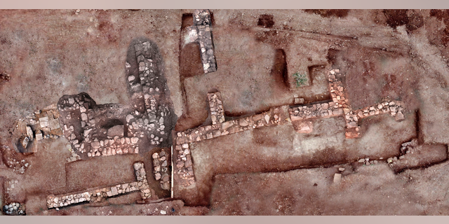 This undated photo provided by the Greek Ministry of Culture on Tuesday, Nov. 13, 2018, shows remains of walls and floors, probably from houses, from the lost ancient city of Tenea. The ministry said Tuesday archaeologists have located the first tangible remains of the city that, according to tradition, was first settled by Trojan war captives after the Greek sack of Troy. (Greek Culture Ministry via AP)
