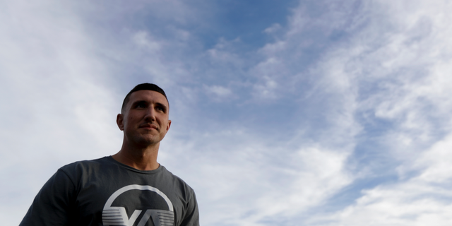 Marine veteran Shaun Tullar poses for a portrait, Thursday, Nov. 1, 2018, in San Diego. The number of homeless veterans across the U.S. declined more than 5 percent over the past year after a slight rise in 2017, the departments of Housing and Urban Development and Veterans Affairs announced Thursday. Tullar spent a time homeless, cycling in and out of jail on drug charges until finding help through a program behind bars that connected him with the VA. He now lives at Veterans Village of San Diego, is sober and working toward finishing a college degree. (AP Photo/Gregory Bull)
