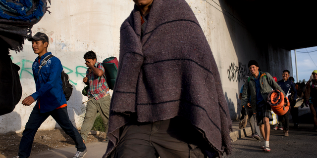 Central American migrants, part of the Central American caravan trying to reach the United States, continue their journey as they leave Mexicali, Mexico, Tuesday, Nov. 20, 2018. Tensions have built as nearly 3,000 migrants from the caravan poured into Tijuana in recent days after more than a month on the road, and with many more months likely ahead of them while they seek asylum in the U.S. (AP Photo/Rodrigo Abd)