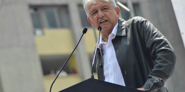 FILE - In this Sept. 29, 2018 file photo, Mexico's President-elect Andres Manuel Lopez Obrador speaks at a rally commemorating the 50th anniversary of a bloody reprisal against students, at the Tlatelolco Plaza in Mexico City. Mexican stocks appeared headed for a second day of losses on Friday, Nov. 9, 2018, after Lopez Obrador floated a proposal to prohibit some commissions charged by private banks. (AP Photo/Christian Palma, File)