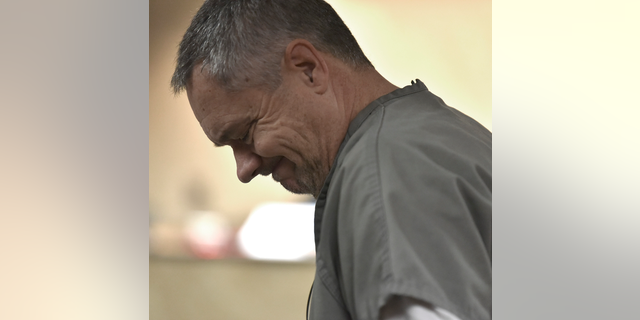 Jeffrey Zeigler looks down as he is sentenced, Tuesday, Nov. 13, 2018 in Oakland County Circuit Court in Pontiac, Mich. The retired firefighter was sentenced to at least four years in prison for shooting at a black teenager who came to his suburban Detroit home asking for directions to school. (Todd McInturf /Detroit News via AP)