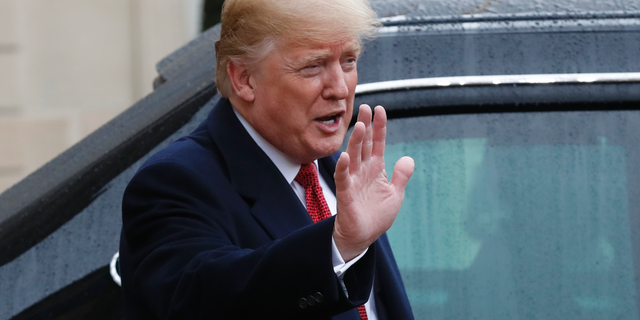U.S President Donald Trump outside the Elysee Palace in Paris, Saturday, Nov.10, 2018. (AP Photo/Thibault Camus)