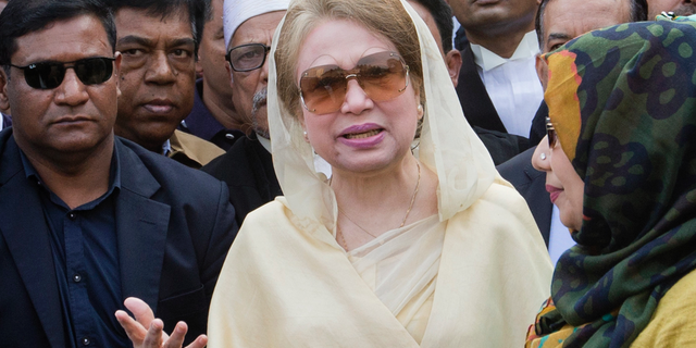 FILE- In this Dec. 28, 2017 file photo, Bangladesh's former prime minister and opposition leader Khaleda Zia, center, leaves after a court appearance in Dhaka, Bangladesh. Bangladesh's Election Commission announced Thursday that the next national election will be held Dec. 23, despite the imprisonment of the main opposition leader. (AP Photo/A.M. Ahad, File)
