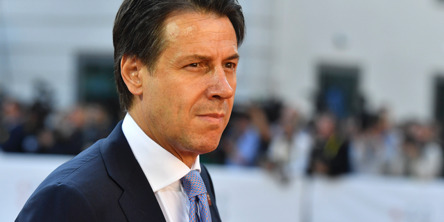 FILE - In this Thursday, Sept. 20, 2018 file photo, Italian Prime Minister Giuseppe Conte arrives at the informal EU summit in Salzburg, Austria. A gathering of leaders of Libya’s quarrelling factions and of countries keen on stabilizing the North African nation opens in Monday Nov. 12, 2018, where Italian Premier Giuseppe Conte will be greeting arrivals Monday evening in Sicily, aimed at finding a political settlement that would bolster the fight against Islamic militants and stop illegal migrants crossing the Mediterranean to Europe’s southern shores. (AP Photo/Kerstin Joensson, File)