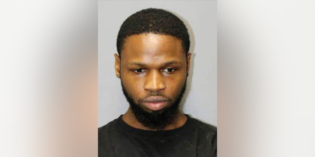 FILE - This undated file booking photo released by the Honolulu Police Department shows Isaiah McCoy. Sex trafficking charges in Hawaii have been dismissed against McCoy, a former death row inmate from Delaware. U.S. prosecutors dropped a 10-count indictment against Isaiah McCoy. A judge approved the dismissal Tuesday, Nov. 13, 2018, and McCoy walked out of court a free man. He tells The Associated Press he wants to relax and continue being an activist against wrongful convictions. (Honolulu Police Department via AP, File)