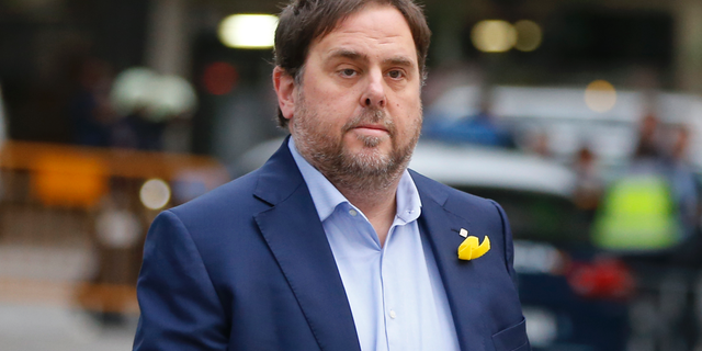 FILE - In this Nov. 2, 2017, file photo, the sacked Catalan Vice President Oriol Junqueras arrives at the National Court for questioning by a National Court judge investigating possible rebellion charges, in Madrid, Spain. Spanish prosecutors on Friday Nov. 2, 2018 are requesting for Junqueras to be imprisoned for 25 years on rebellion charges, the highest prison term in indictments issued for separatist leaders who pushed for Catalan independence last year. (AP Photo/Paul White, File)