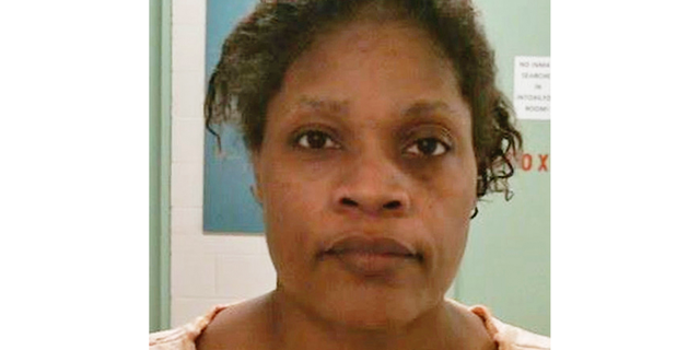 FILE - This photo provided by the Bolivar County Sheriff's Office shows Carolyn Jones, who was taken into custody in Mississippi, on Oct. 16, 2018. Jones was charged with first-degree murder after her 20-month-old granddaughter, Royalty Marie Floyd, was found stabbed and burned inside an oven. Floyd was buried Saturday, Nov. 3 by relatives who are still in shock over her death. A preliminary autopsy found the toddler was still alive when she was placed in an oven Oct. 15 at a home in Shaw. Her death was caused by stab wounds and thermal injuries, the autopsy said. (Bolivar County Sheriff's Office via the AP, File)