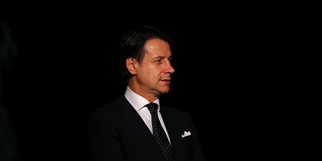 Italian Prime Minister Giuseppe Conte arrives for a Libya conference in Palermo, Italy, Monday, Nov. 12, 2018. Representatives of Libya's quarrelling factions and of countries keen on stabilizing the North African nation started meetings in Sicily Monday, as Italy encourages a political settlement that could bolster the fight against Islamic militants and stop illegal migrants from crossing the Mediterranean to Europe's southern shores. (AP Photo/Antonio Calanni)