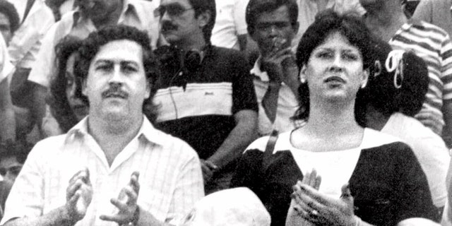 FILE - In this undated file photo, the late Pablo Escobar, former boss of the Medellin drug cartel, his wife Maria Henao and their son Juan Pablo, attend a soccer match in Bogota, Colombia. The widow of Pablo Escobar fell madly in love as a preteen with the man who would rise to be a ruthless drug lord, but says in a new book she felt raped when at age 14 he forced her to have an abortion, and over time came to view him as a cruel psychopath. (El Tiempo Photo via AP File)