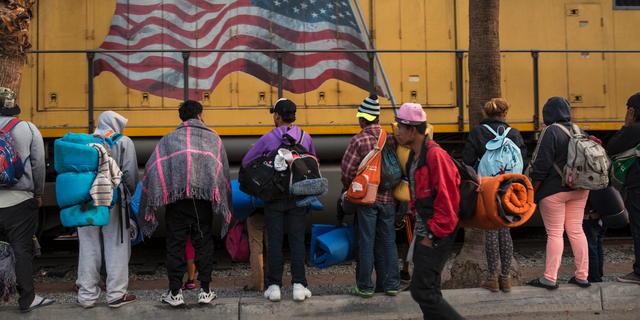 Central American migrants, part of the Central American caravan trying to reach the United States, continue their journey as they prepare to leave Mexicali, Mexico, Tuesday, Nov. 20, 2018. Tensions have built as nearly 3,000 migrants from the caravan poured into Tijuana in recent days after more than a month on the road, and with many more months likely ahead of them while they seek asylum in the U.S. (AP Photo/Rodrigo Abd)