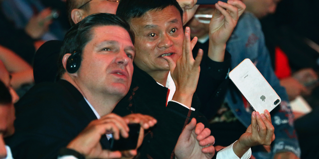 Jack Ma, Alibaba's chairman, chats after the start of Alibaba's 11.11 Global Shopping Festival held in Shanghai, China, early Sunday, Nov. 11, 2018. What started out ten years ago as a day of online promotion with US$7.8million in sales has grown into the world's biggest e-commerce event generating US$25.3billion in 2017. (AP Photo/Ng Han Guan)