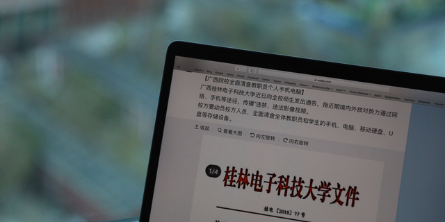 In this photo taken Thursday, Nov. 15, 2018, a computer screen shows the leaked online post from Guilin University of Electronic Technology warning of "hostile domestic and foreign powers" that were "wantonly spreading illicit and illegal videos" through the internet in Beijing, China. (AP Photo/Ng Han Guan)