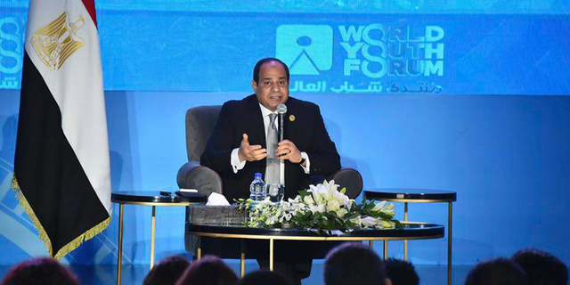 In this photo provided by Egypt's state news agency MENA, Egyptian President Abdel-Fattah el-Sissi, speaks during a youth conference in Sharm El Sheikh, Egypt, Monday, Nov. 5, 2018. Addressing the international youth conference late Sunday el-Sissi said that the 2011 Arab Spring revolt was an ill-advised attempt at change whose chaotic aftermath posed an existential threat to the nation. Egypt's president said those behind the revolt had good intentions but had inadvertently "opened the gates of hell." (MENA via AP)