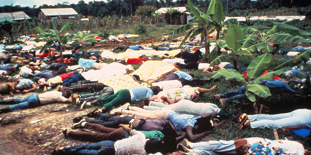 FILE - This November 1978 file photo shows the bodies of Peoples Temple mass suicide victims led by Jim Jones in Jonestown, Guyana. Dozens of Peoples Temple members in Guyana survived the mass suicides and murders of more than 900 because they had slipped out of Jonestown or happened to be away Nov. 18, 1978. Those raised in the temple or who joined as teens lost the only life they knew. They have journeyed over the past 40 years through grief over lost loved ones, feeling like pariahs, building new lives and, finally, acknowledging that many had a role in enabling the Rev. Jim Jones to seize control over his followers. (AP Photo/File)