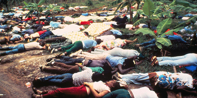 FILE - This November 1978 file photo shows the bodies of Peoples Temple mass suicide victims led by Jim Jones in Jonestown, Guyana. Dozens of Peoples Temple members in Guyana survived the mass suicides and murders of more than 900 because they had slipped out of Jonestown or happened to be away Nov. 18, 1978. Those raised in the temple or who joined as teens lost the only life they knew. They have journeyed over the past 40 years through grief over lost loved ones, feeling like pariahs, building new lives and, finally, acknowledging that many had a role in enabling the Rev. Jim Jones to seize control over his followers. (AP Photo/File)
