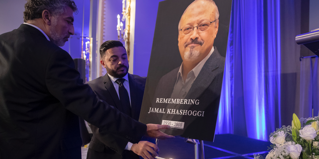 Mongi Dhaouadi, left, and Ahmed Bedier set up an image of slain Saudi journalist Jamal Khashoggi before an event to remember Khashoggi, a columnist for The Washington Post who was killed inside the Saudi Consulate in Istanbul on Oct. 2, in Washington, Friday, Nov. 2, 2018. (AP Photo/J. Scott Applewhite)