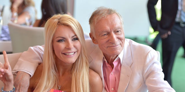 Crystal Hefner, pictured in 2013 with the late Hugh Hefner, shamed the "culture" of today for placing high expectations on women's bodies.
