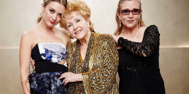 Billie Lourd, left, Carrie Fisher, center, and Debbie Reynolds pose during TNT's 21st Annual Screen Actors Guild Awards at The Shrine Auditorium on January 25, 2015 in Los Angeles, Calif. (Photo by Kevin Mazur/WireImage)