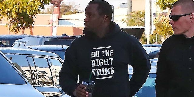 Sean 'Diddy' Combs appears completely shaken as he is seen arriving at an office building in Los Angeles a day after his ex Kim Porter's sudden death. The music mogul was seen entering a specialized movement rehabilitation center this afternoon. Kim passed away in her home yesterday. The couple have three children together.