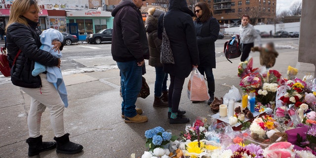 In this March 8, 2018 file photo, people gather at a sidewalk memorial for two children who were killed the previous week when they were struck by a car driven by a woman who likely had a seizure behind the wheel, in the Park Slope neighborhood of the Brooklyn borough of New York. Dorothy Bruns was found dead in her home in Staten Island borough of New York on Tuesday, Nov. 6.