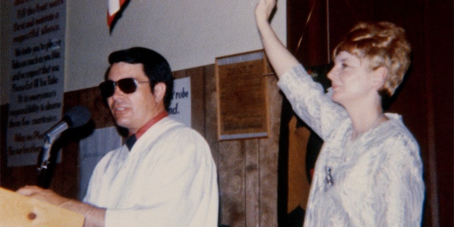 This image of Reverend Jim Jones and his wife, Marceline, was taken from a photo album left behind in the village of the dead in Jonestown, Guyana, during Reverend Jones' happier times. Jones led more than 900 members of his cult to a painful death. (Getty Images)