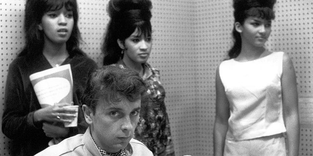 The Ronettes, a popular New York girl group, were signed by Phil Spector.