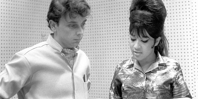 Ronnie Spector of the vocal trio the Ronettes with Phil Spector while recording in Los Angeles, California at Gold Star Studios in 1963.