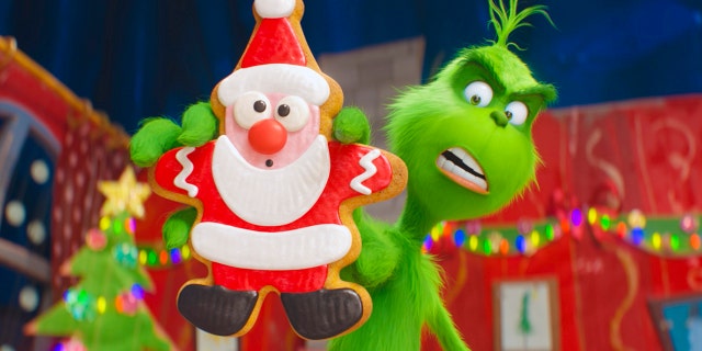 This image released by Universal Pictures shows the character Grinch, voiced by Benedict Cumberbatch, in a scene from "The Grinch." (Universal Pictures via AP)