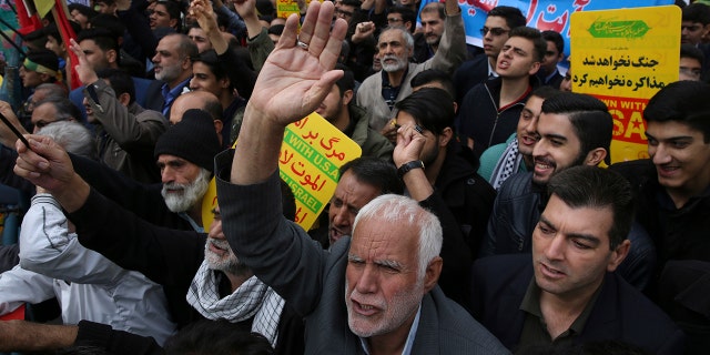 Demonstrators chant slogans during an annual rally in front of the former U.S. Embassy in Tehran, Iran, on Sunday, Nov. 4, 2018, to mark the 39th anniversary of the seizure of the embassy by militant Iranian students.